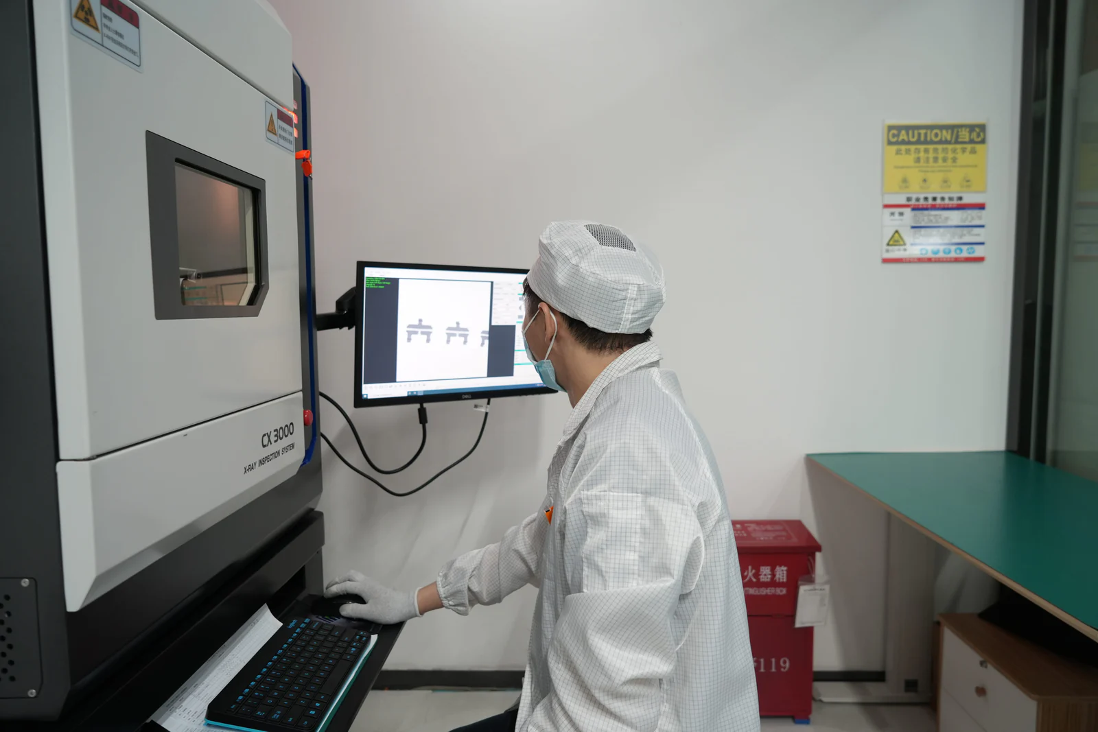 Laboratory technician operating an X-ray inspection system