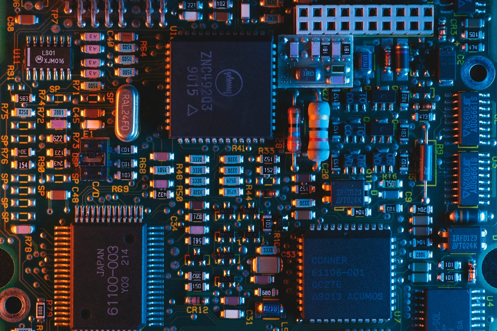Integrated circuits and electronic components on a blue circuit board