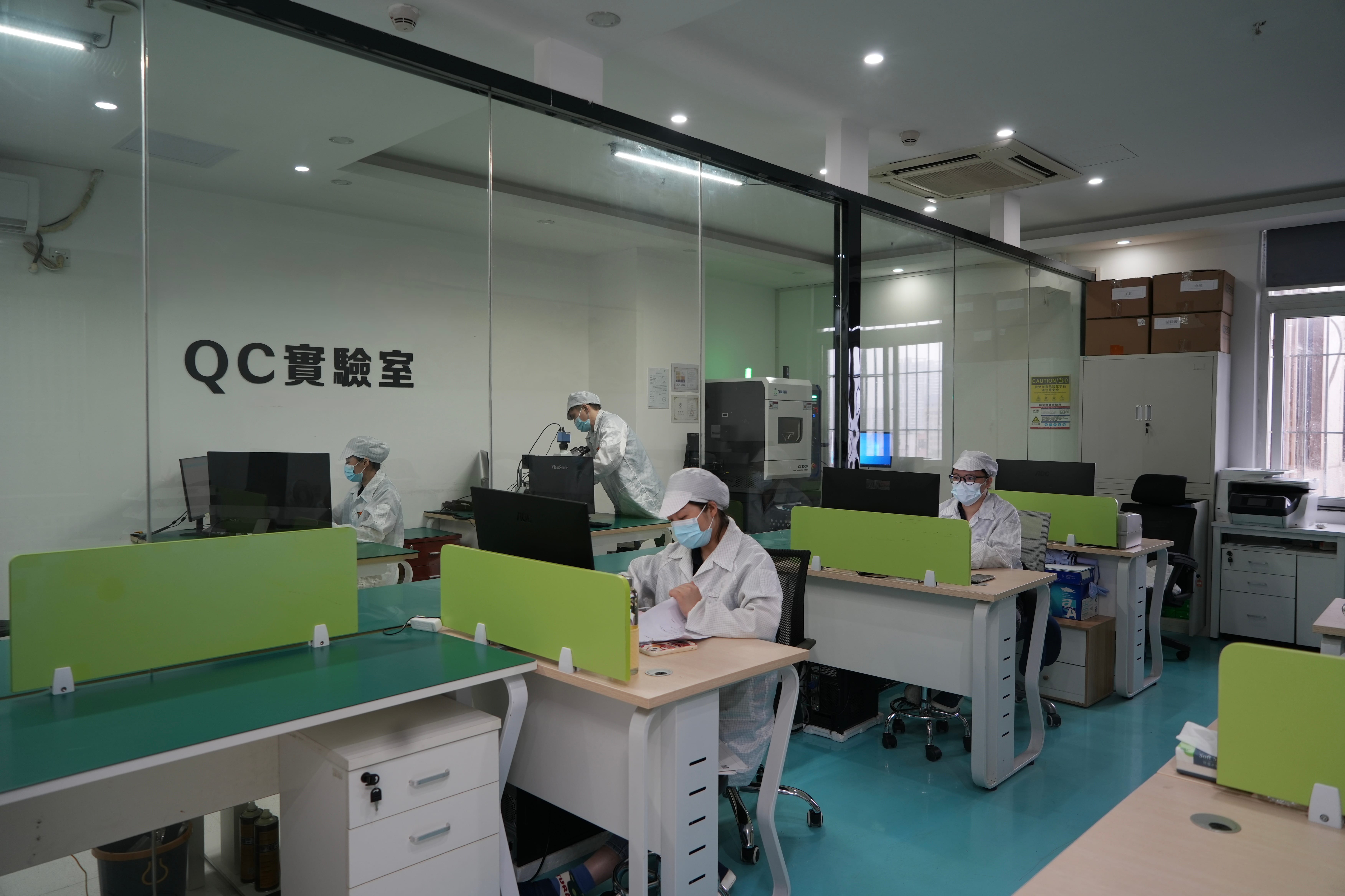 Quality inspection team working inside the component laboratory